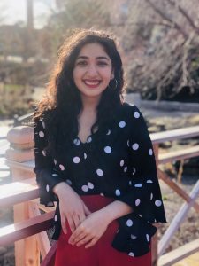 Shehrose Charania with her arm rested on a bridge