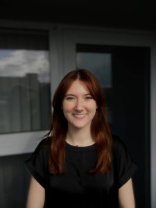 Headshot of a woman in a black shirt