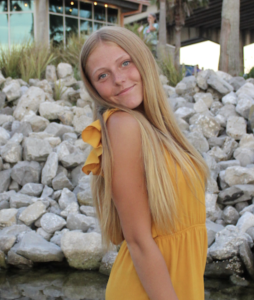 Photo of a woman in a blonde dress