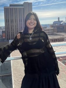 Photo of a woman standing outside