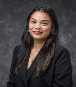Headshot of a woman in a black blazer