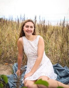 Photo of a woman in a white dress