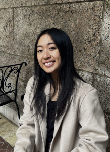Headshot of a woman in a tan blazer