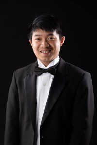 Photo of a man in a black suit