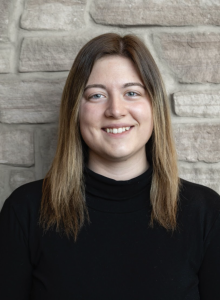Headshot of a woman in a black shirt