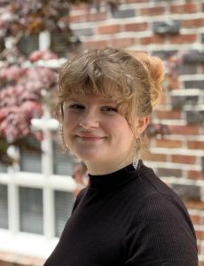 Headshot of a woman in a black shirt