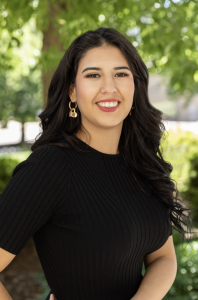 Headshot of a woman in a black shirt