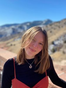 Photo of a woman in a black shirt outside