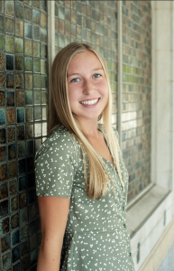 Photo of a woman in a green shirt smiling