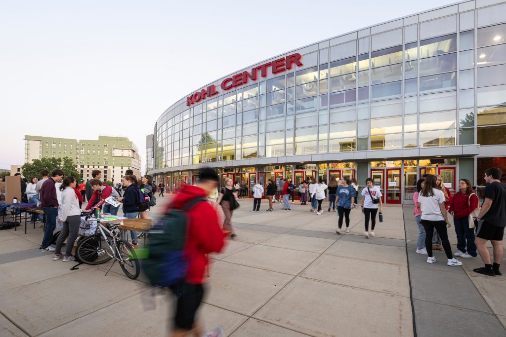 Students make their way through a selection of outdoor information tables as they take part in the annual Fall Student Organization Fair at the Kohl Center at the University of Wisconsin–Madison.