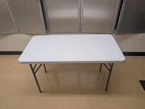 A four-foot table fully set up.