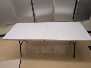 A foldable 6-foot table fully set up.
