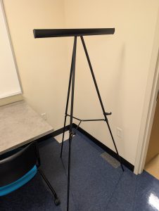 A black easel with no poster attached to showcase the resource.