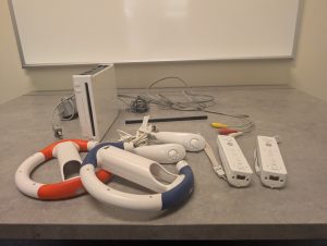 The PRC's "Wii Kit" including the console, A/V wires, charging cord, two controllers, two racing wheels, and two nunchucks.