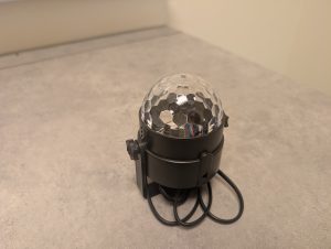 One disco light on a counter top.