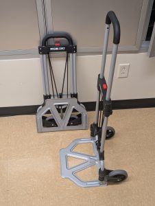 Two foldable dollies. One is folded and one is unfolded to show the difference.