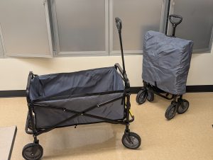 Two foldable wagons. One is unfolded and the other is folded to show the difference.
