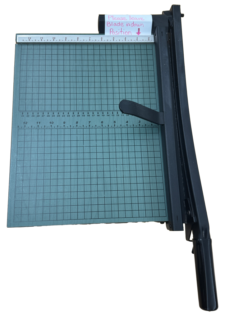 a hand cutter to cut paper