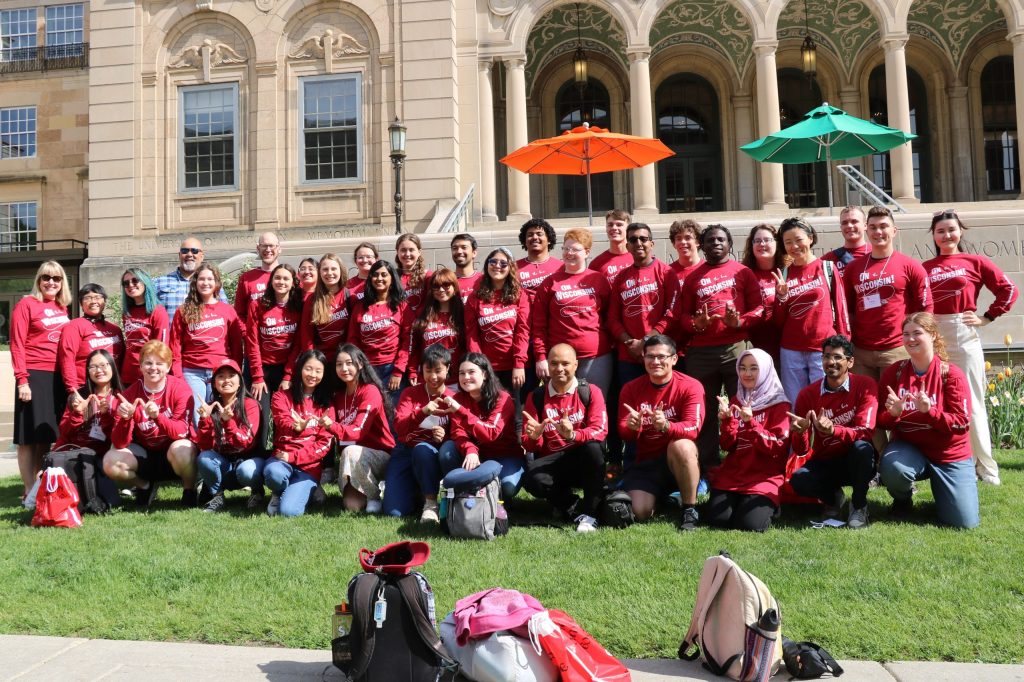2023 WEBT participants wearing matching red program shirts with Dr. Lori Ressor in from of Memorial Union.