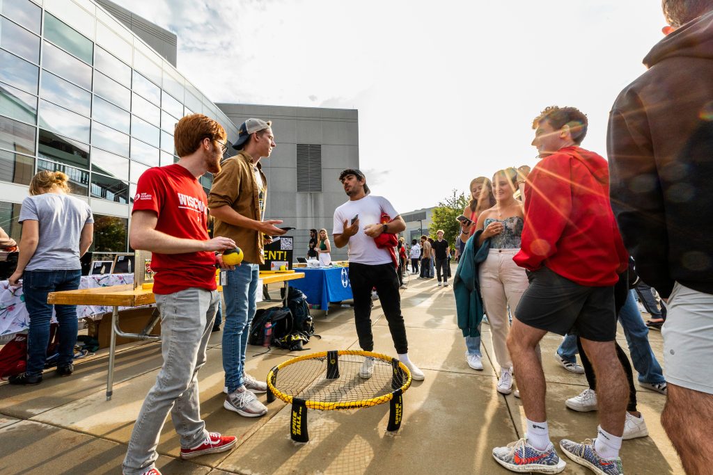 Members of the Roundnet Club talk to prospective club members during the Fall Student Organization Fair at the Kohl Center at the University of Wisconsin–Madison