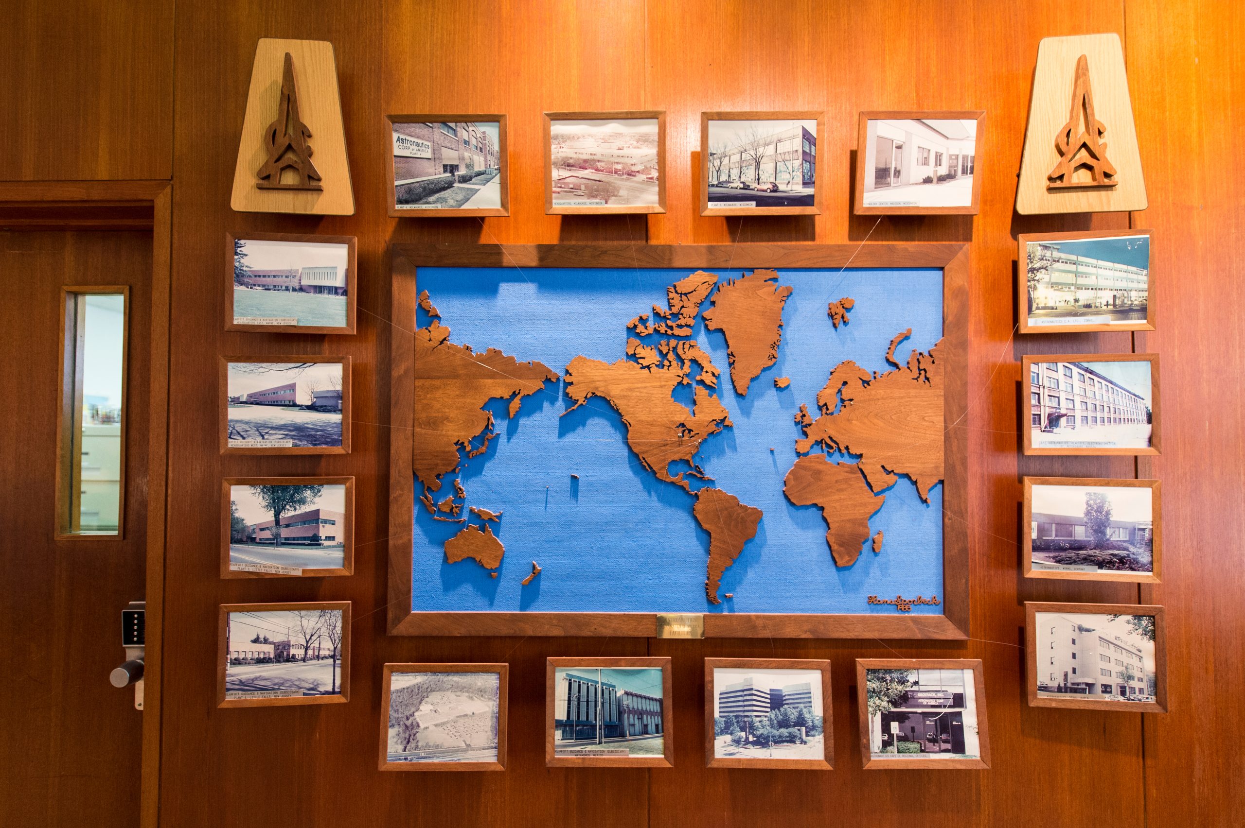 The world map engraved in a wooden wall.