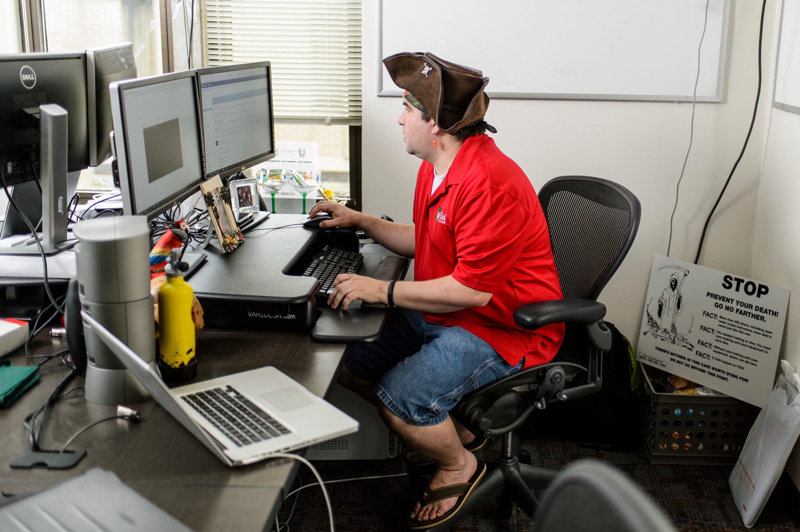Tech service consultant in the Department of Information Technology works on his computer in the Computer Sciences Building at the University of Wisconsin-Madison.