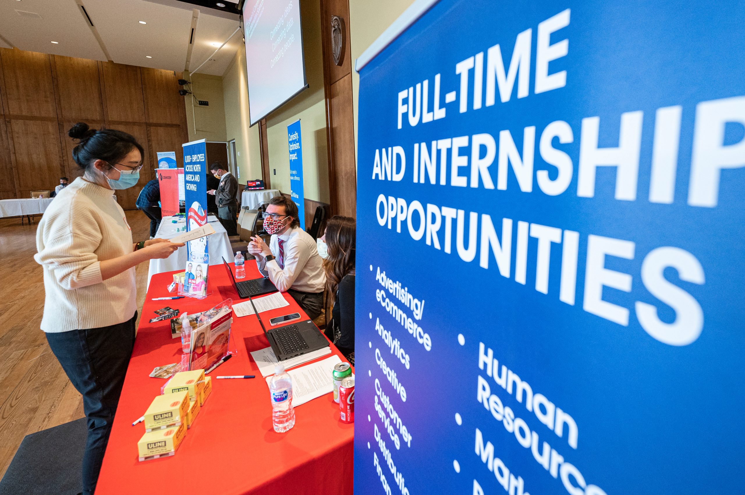 Representatives from Uline talk with students during a School of Computer, Data and Information Sciences (CDIS) career fair held in Varsity Hall inside Union South at the University of Wisconsin–Madison.