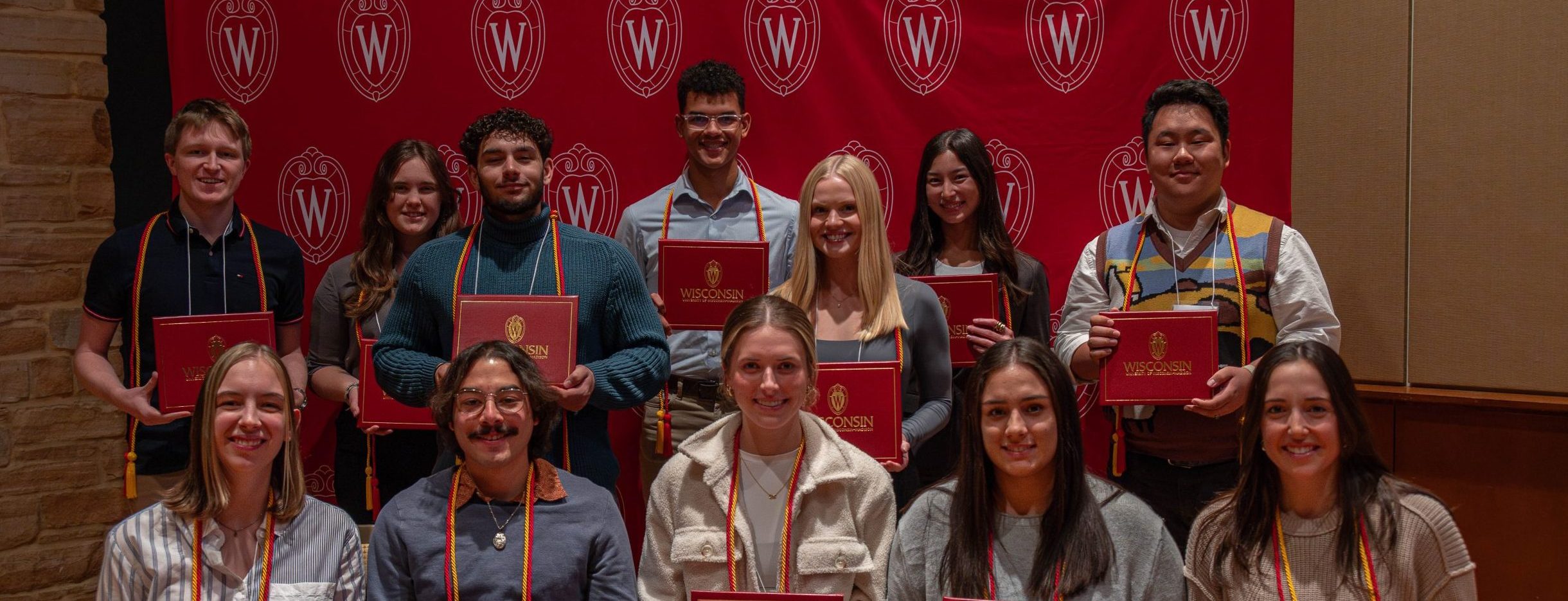 Twelve students holding certificates at the Leadership Certificate ceremony.