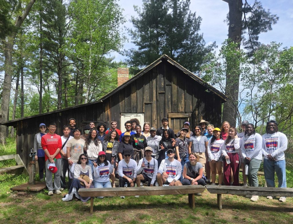 An outdoor group photo of 2025 WEBT students outside of the Aldo Leopold house/shack.