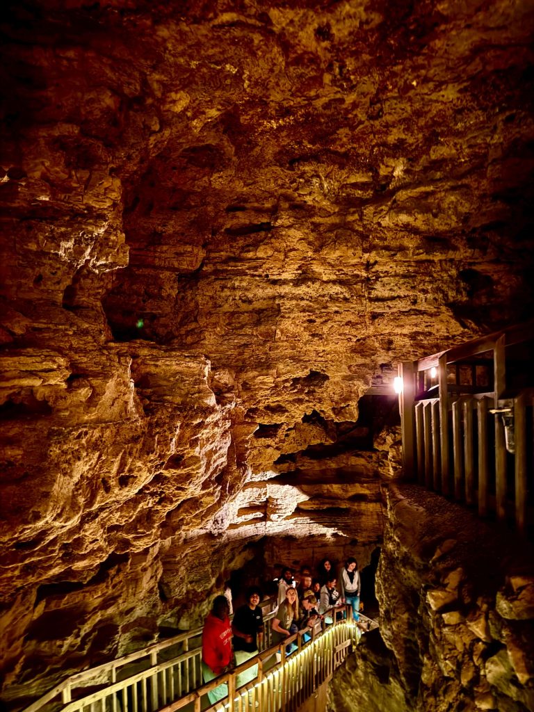 A candid photo of 2025 WEBT students during the Crystal Cave tour.