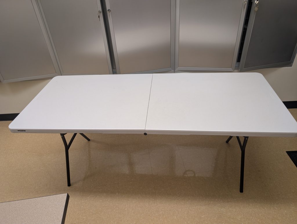 A foldable 6-foot table fully set up.