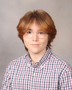 Person smiling with glasses