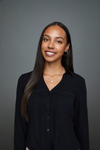 Woman smiling wearing black top