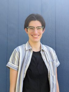 Student smiling with glasses