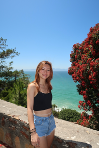 Woman smiling by ocean