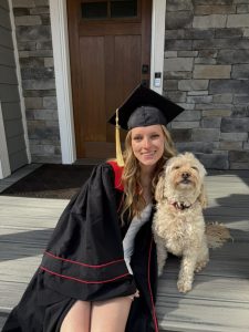 Woman smiling with their dog