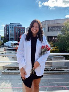 Woman smiling holding flowers