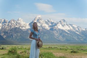 Woman smiling with mountains in the background