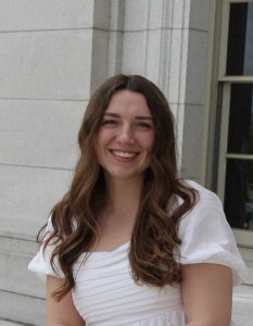 Woman smiling in white dress