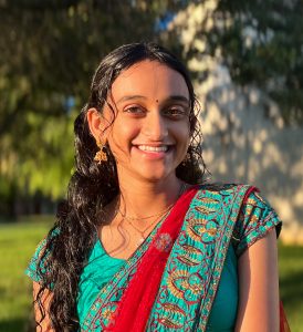 Woman smiling in green outfit
