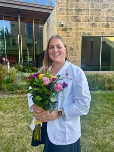 Woman smiling with flowers