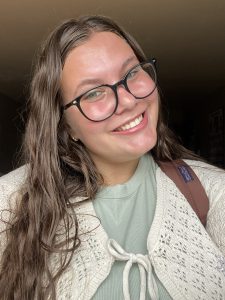 Woman with glasses smiling