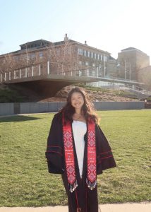 Woman smiling in graduation gown