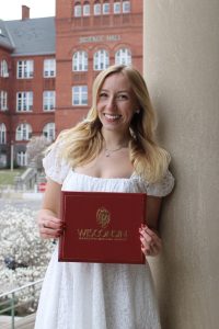 Woman smiling with diploma