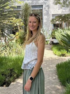 Woman smiling near plants