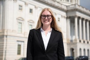 Woman with glasses smiling