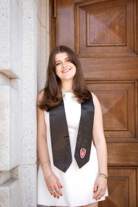 Woman smiling wearing white dress
