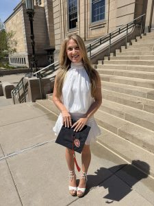 Woman smiling with graduation cap