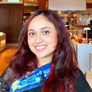 Woman smiling with blue scarf