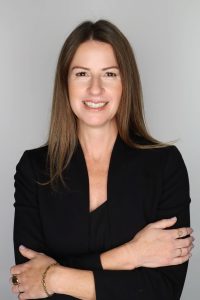 Woman crossing arms and smiling